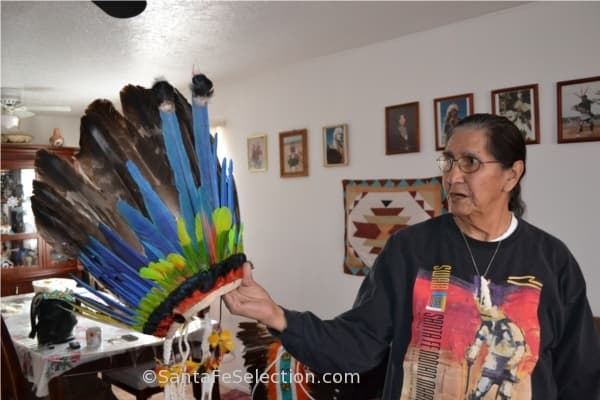 Andy Garcia showing a ceremonial feather head dress.